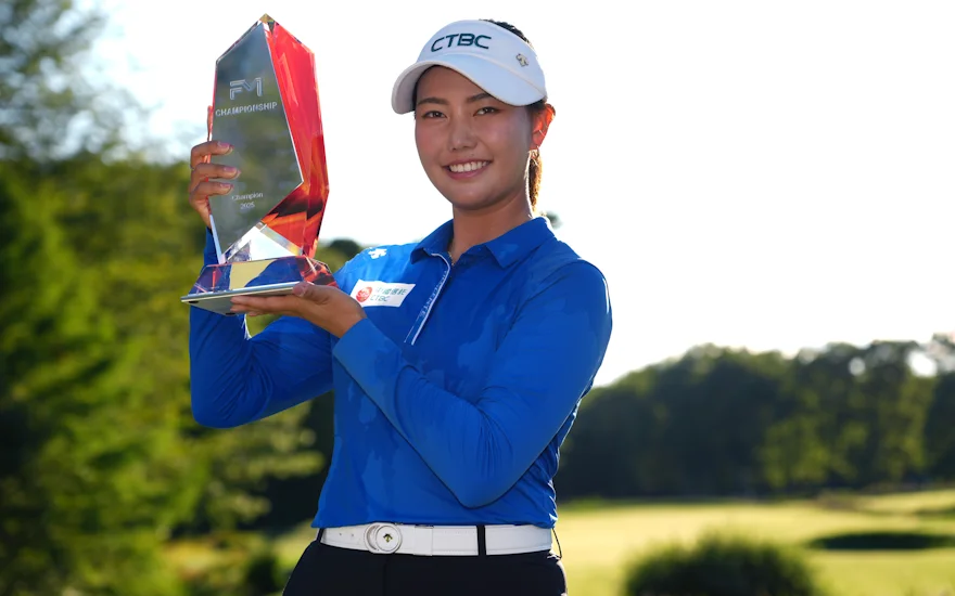 Miranda Wang lifting the trophy in celebration of her FM Championship victory